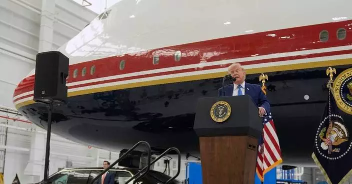 President Donald Trump unveils the new Air Force One, a converted Qatari jet