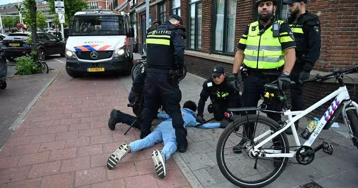 Soccer fans clash with police in The Hague after Morocco stuns the Netherlands at the World Cup