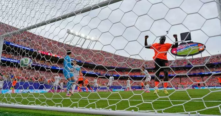 Brian Brobbey and the Dutch roll in the rain to a 3-1 win over Tunisia to top World Cup Group F