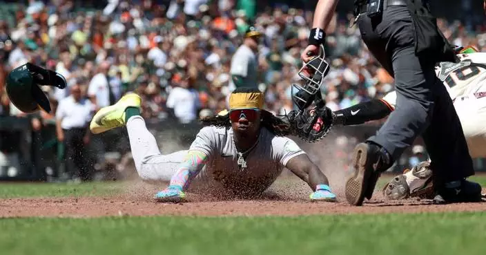 Athletics score 4 times with 2 out in the 9th inning, rally to beat the Giants 9-6