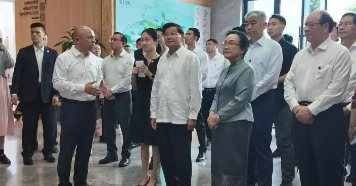 Lao president visits renowned Chinese village to learn about green development