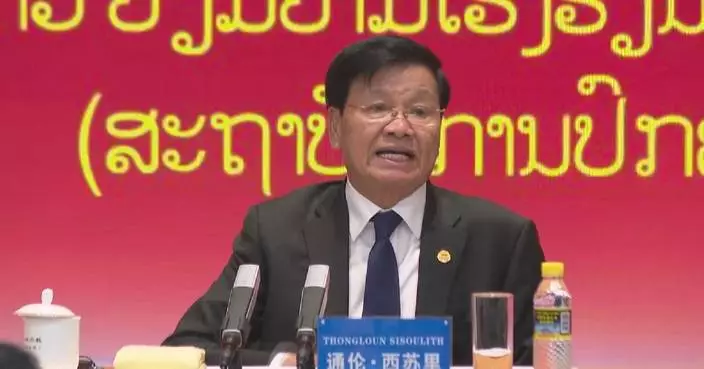 Lao president visits Party School of CPC Central Committee