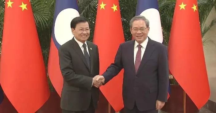 Chinese premier meets visiting Lao president on relations