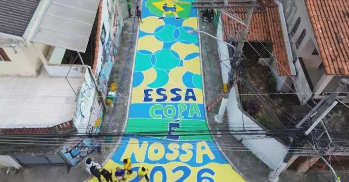 Sao Paolo neighborhood paints street in national colors as World Cup fever builds
