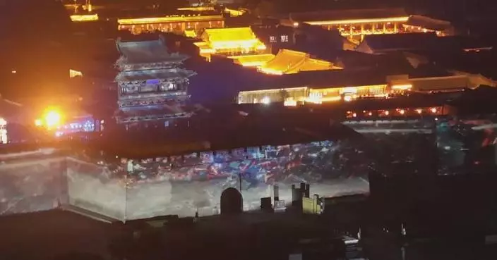 North China ancient town tries to boost nighttime visitor numbers with light show, immersive performances