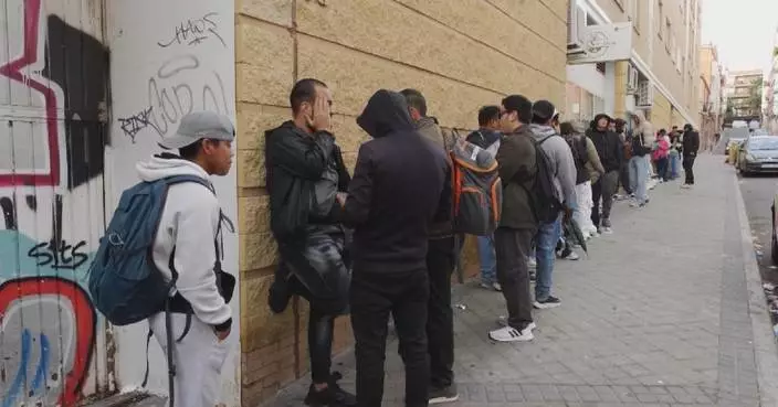 Undocumented migrants in Spain line up for access to legal status