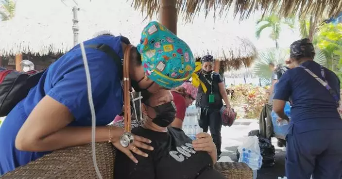 Medical workers provide emergency care at temporary medical station for quake victims in Venezuela