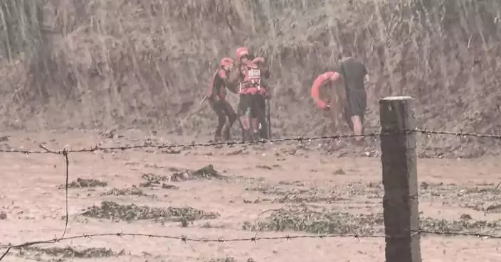 Firefighters rescue man trapped by flash flood in north China