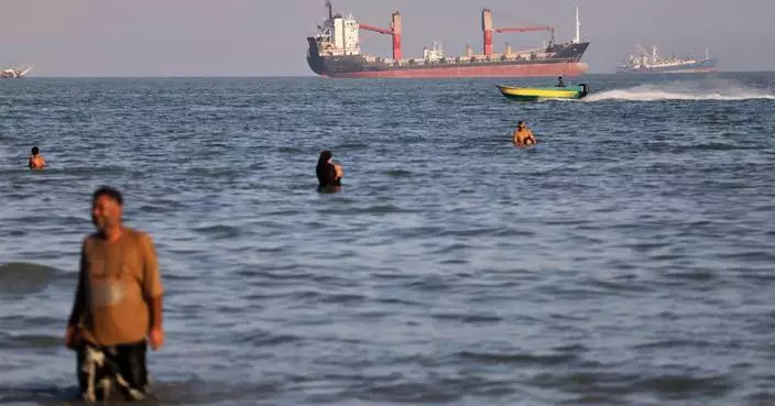 An oil tanker navigates the Strait of Hormuz despite threats from Iran's Revolutionary Guard