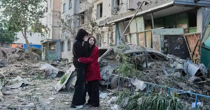 Russian attack on Ukraine kills at least 11 and traps others in damaged buildings