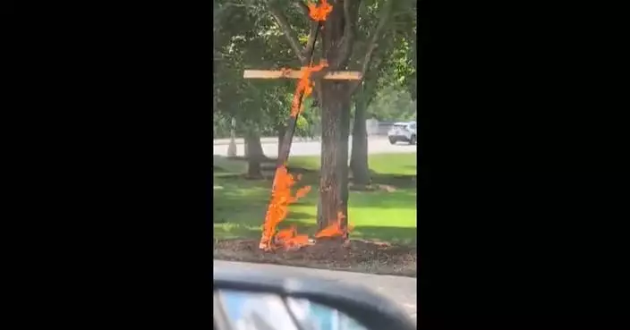 A person is in custody in a Chicago cross burning investigation, police say