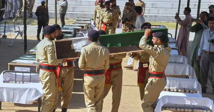 A mass funeral is held for 22 Pakistani soldiers who died in a helicopter crash in Kashmir