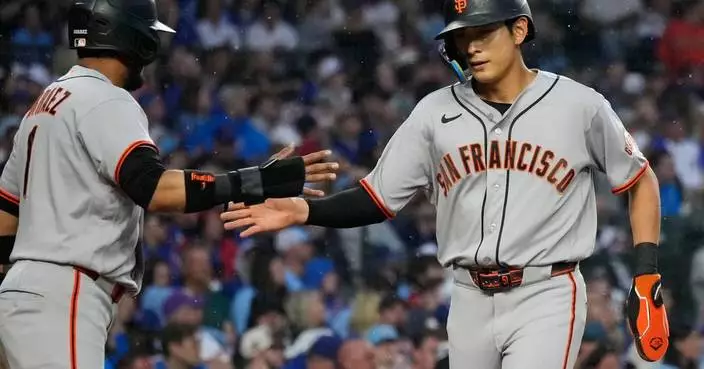 Chapman’s 10th-inning single gives the Giants a 2-1 win over the Cubs