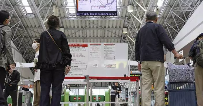 Heavy rain pounds western Japan as 2 tropical storms approach