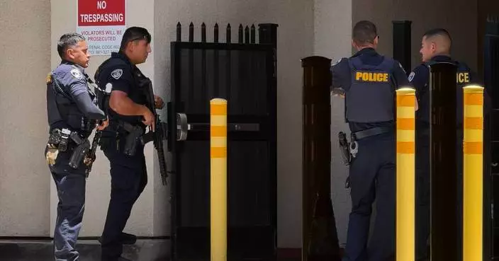 Police say man barricaded himself inside bank building with others in California city of Bakersfield