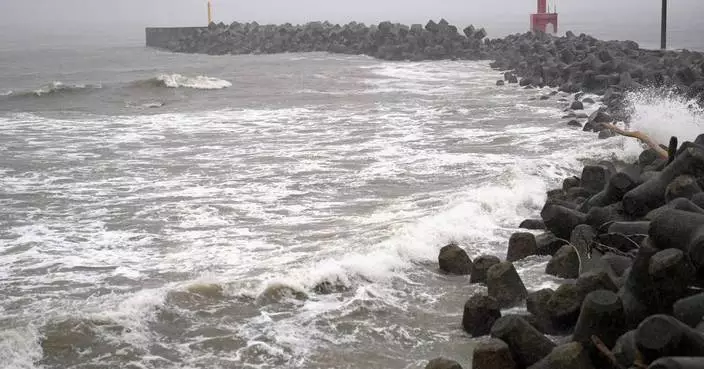Two tropical storms pound Japan, causing flooding and landslides