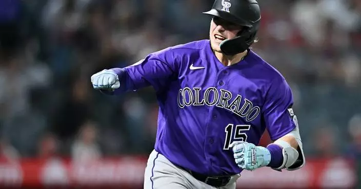 Goodman's 3-run homer and Rumfield's sac fly help Rockies rally for 9-8 win over Angels