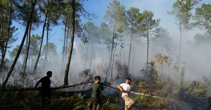 Firefighters in France hold back vast wildfire as heat returns to test their grip