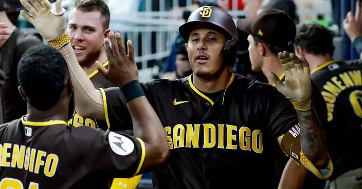 Machado homers twice, Tatis hits longest homer of season to lead Padres to 8-3 win over Braves