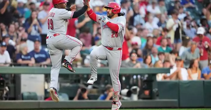 Suárez homers against former team and Burns throws 5 scoreless innings as Reds beat Mariners 4-2