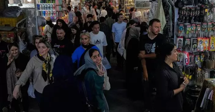 US strikes bridges and collapses a tower at a key port as its Iran campaign expands