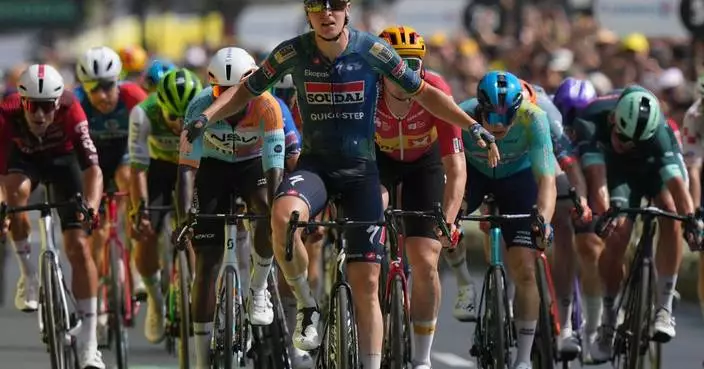 Belgian rider Merlier wins stage 7 as Tour favorite Pogacar keeps the yellow jersey
