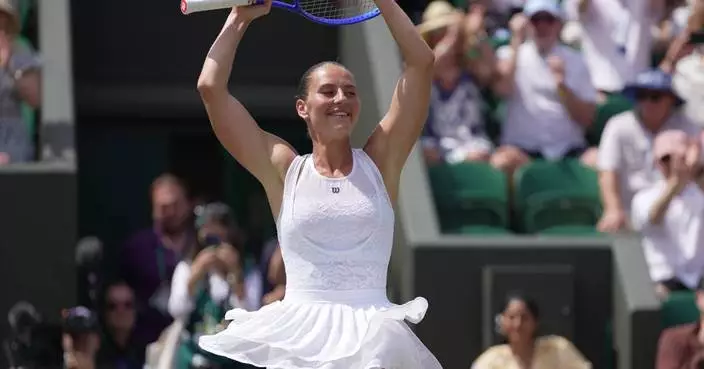 Ukraine's Marta Kostyuk advances to Wimbledon quarterfinals as Roger Federer pays visit