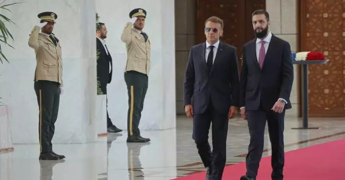 Explosions rock Damascus, wounding 18, as French President Macron visits Syria