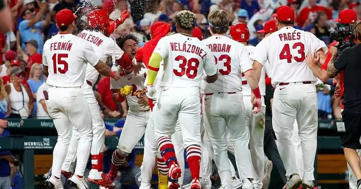 Herrera doubles as Cardinals rally to beat Cubs 3-2 in 10 innings