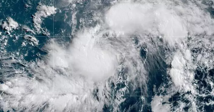Hurricane Genevieve moves through the Pacific off Mexico, but no direct threat to land is forecast
