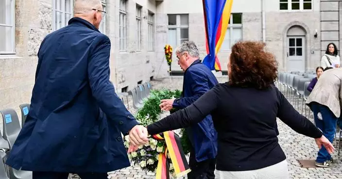 Descendant of Nazi opponent tries to remove far-right party's wreath at Hitler plot memorial event