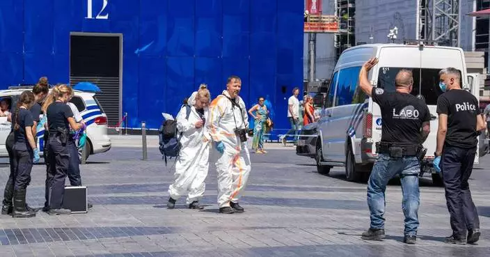 Authorities looking for 6 missing in a Brussels building fire find charred bodies in a lift