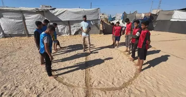 Gazans play their own "World Cup" at stadium-turned shelter