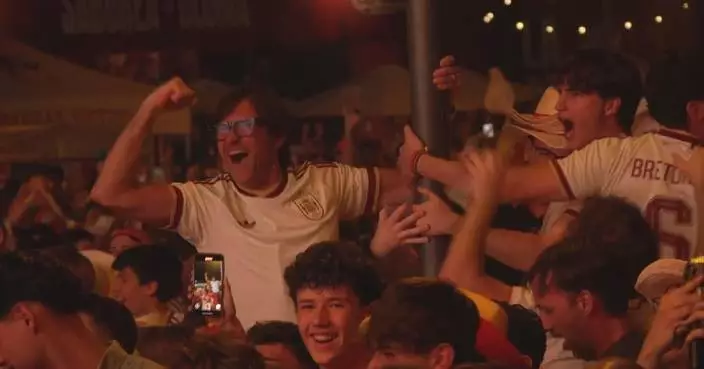 Supporters in Madrid celebrate as Spain defeats Portugal in World Cup 1/8 Final