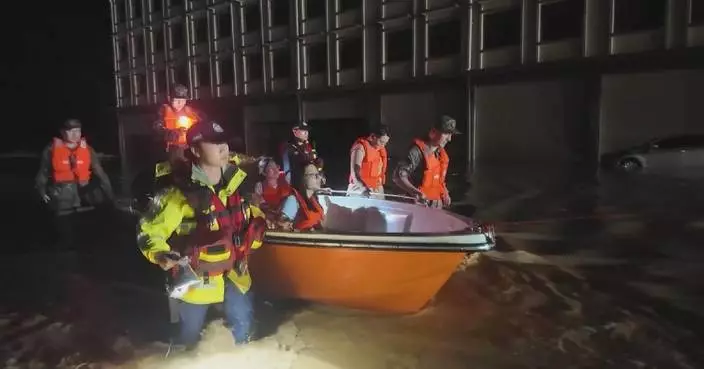 Pregnant woman rescued from flooded home in Guangxi