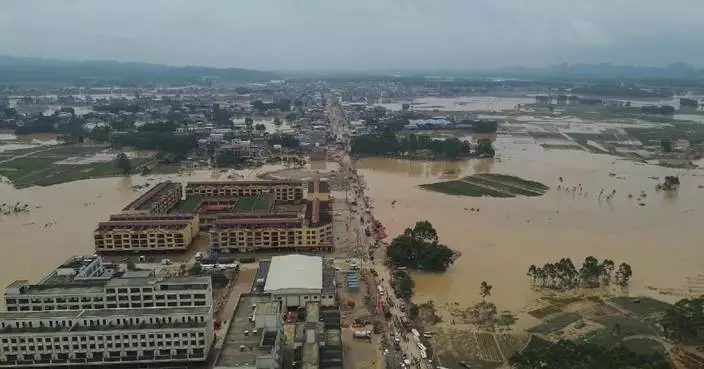 Drones help deliver essential supplies to cut-off villages in south China's flood-hit Guangxi