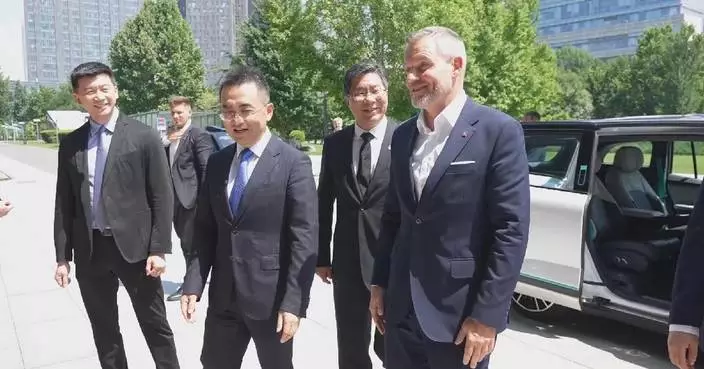Slovak president visits headquarter of Chinese tech giant, rides self-driving car