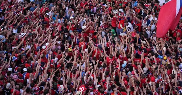 One Extraordinary Photo: Red-clad Norway fans who have become a World Cup sensation