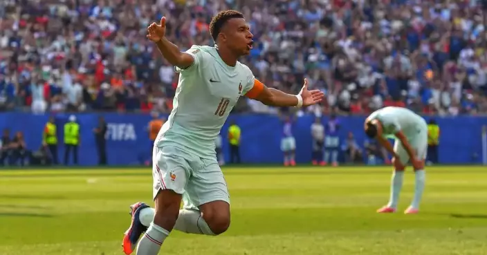 Kylian Mbappé scores his 8th World Cup goal before leaving game with a 'slight' ankle injury