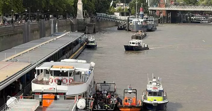 Police boat crashes into bridge in central London, sending officers into the Thames