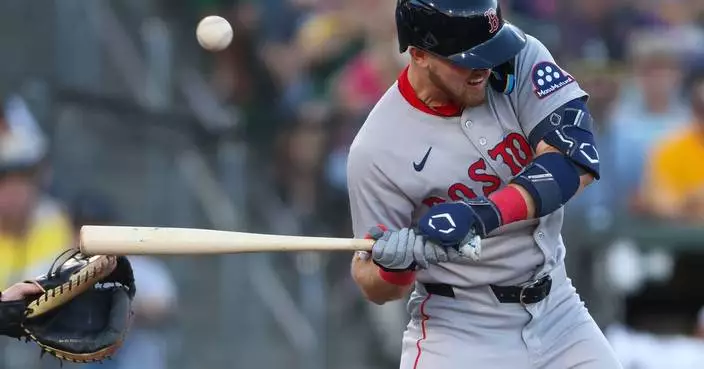 Curtis Mead leaves after being hit on the wrist by a pitch in 2nd at-bat with Red Sox