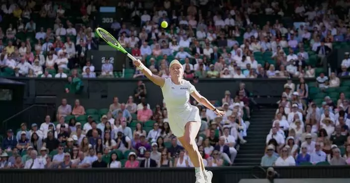 Centre Court crowd at Wimbledon keeps one eye on England's World Cup match