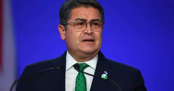 Former President Juan Orlando Hernández returns to Honduras after arrest warrant suspended