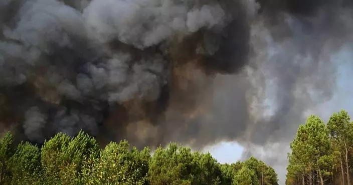 Tens of thousands of French wildfire evacuees allowed to return home as cooler weather moves in