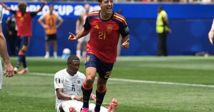 Mikel Oyarzabal's 2 goals send dominant Spain past Austria 3-0 and into round of 16 at the World Cup