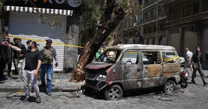 Syria says it arrested suspects behind the Damascus bombings during Macron's visit