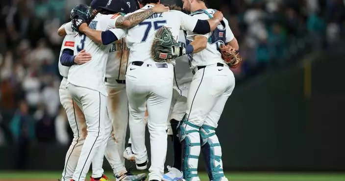 Mariners have big sixth inning to back Woo in an 8-3 victory over the Angels