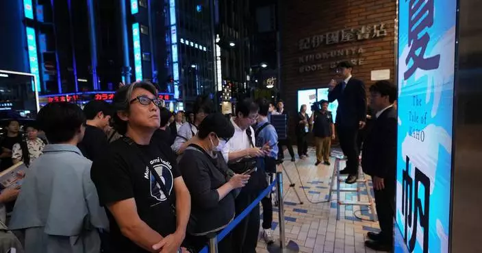 Fans mark the release of new Haruki Murakami novel at a midnight event in Tokyo