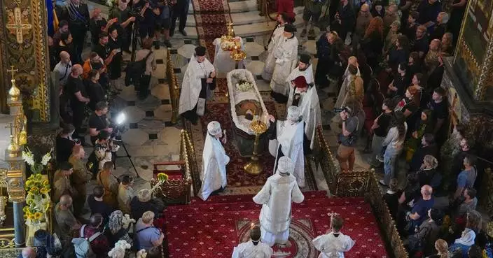 Ukraine honors its 'collector of souls' killed while recovering the war dead