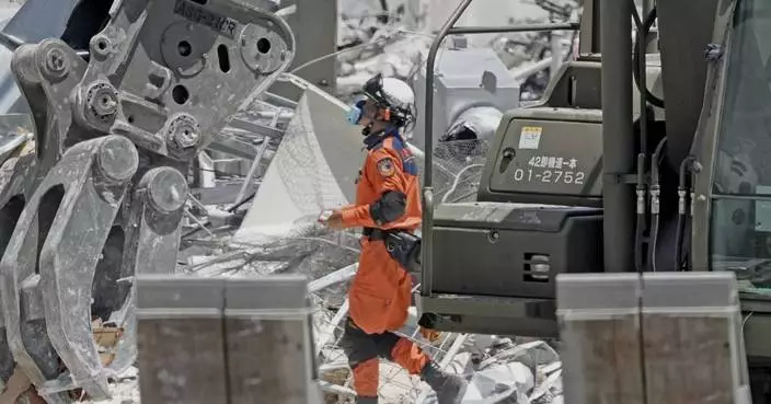 A woman with apparent heat stroke found dead while taking shelter in a car in quake-hit Japan